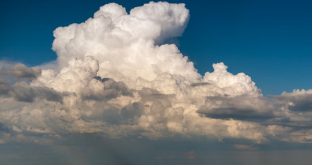 Blue sky with white summer rain clouds. Colorful summer landscapeの写真素材