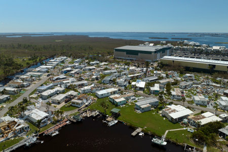 Destroyed by hurricane strong winds suburban houses in Florida mobile home residential area. Consequences of natural disasterの写真素材