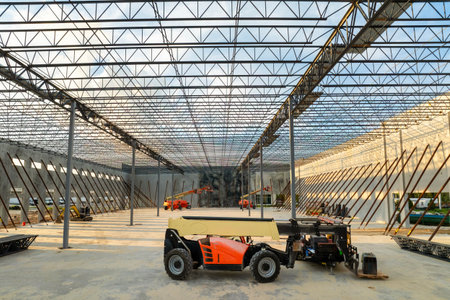 Development of commercial real estate in USA. Construction works on monolithic frame at large building site of logistics distribution warehouseの写真素材