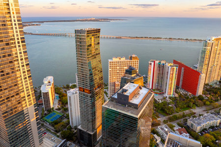 Downtown district of Miami in Florida, USA at sunset. Waterfront urban landscape of high skyscraper buildings near Biscayne Bay in modern American megapolisの写真素材