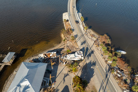 Natural disaster aftermath. Destroyed yachts after hurricane Milton on Manasota Key in Englewood, Floridaの写真素材