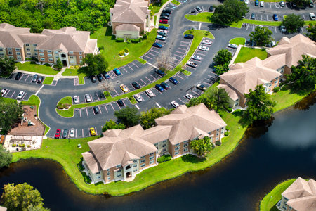 New apartment condos in Florida suburban area. Family housing in quiet neighborhood. Real estate development in American suburbsの写真素材