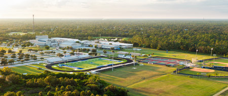 Public high school open air sports facilities in North Port, Florida. American football stadium, tennis courts and baseball diamond sport infrastructureの写真素材