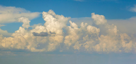 Rain clouds forming on blue Florida sky. Colorful summer skyscapeの写真素材