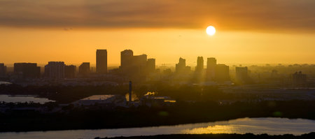 Urban sunset landscape of downtown district of Tampa city in Florida, USA. Dramatic skyline with high skyscraper buildings in modern american megapolisの写真素材