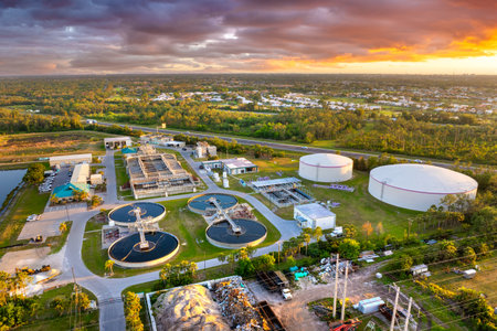 Aerial view of water treatment factory at city wastewater cleaning facility. Purification process of...