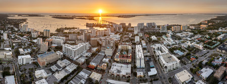 Aerial view of Sarasota city downtown at sunset with high-rise office buildings and Ringling Bridge on horizon. Real estate development in Florida. USA travel destinationの写真素材