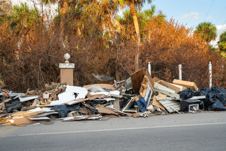 Hurricane damage in Florida. Piles of rubbish on street side from destroyed houses. Consequences of natural disasterの写真素材