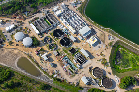 Aerial view of water treatment factory at city wastewater cleaning facility. Purification process of...