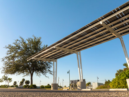 Photovoltaic solar panels over car parking lot for generation of renewable energy. Sustainable power...