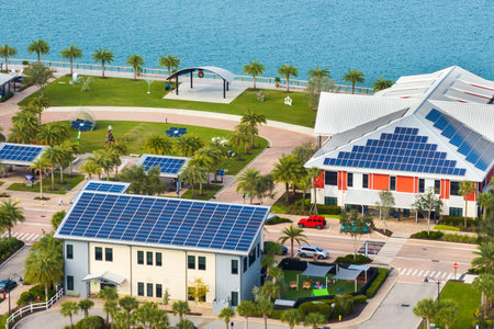 Florida office buildings with solar roofs. Blue photovoltaic panels for producing clean ecological...