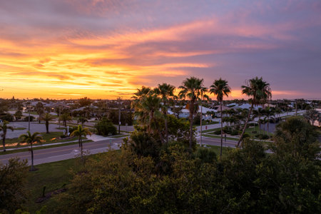 Evening light over Florida waterfront community. Expensive homes and luxury mansions illuminated by sundown sky.の写真素材