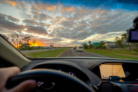 Drivers view from inside a car on a rural highway road with vehicles moving forward. Motion,...
