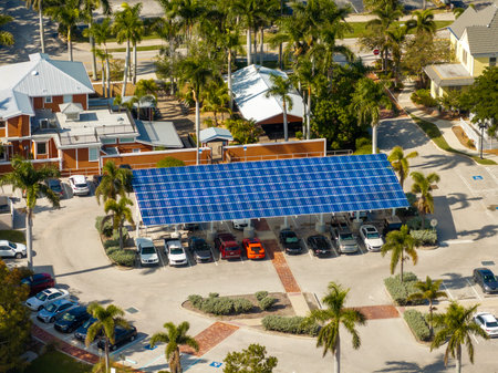 Sustainable power production integrated in urban infrastructure. Photovoltaic solar panels over car parking place for generation of renewable energy.の写真素材