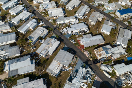 Aerial view of natural disaster consequences. Severely damaged by hurricane Ian mobile homes in...