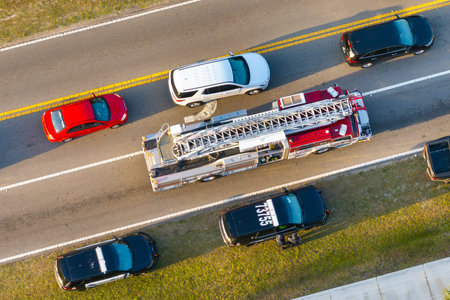Car crash with first responders helping at accident site on American street. Vehicle collision on...