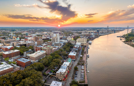Aerial view of River Street in Savannah, Georgia. American city old historical architecture. USA panoramic cityscape at nightの写真素材
