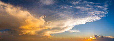 Amazing sunset skyscape. Evening sky with bright colorful orange and yellow clouds