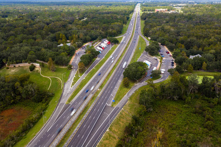 Rest area for cars and semi trucks near busy interstate freeway. Truck stop place during hauling...