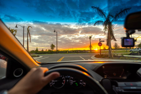 Drivers perspective on Florida roadway at twilight. Driving car on American road.