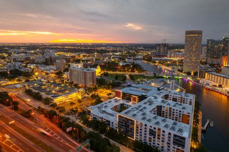 Downtown of Tampa in Florida, USA. Car traffic on city streets and brightly illuminated high skyscraper buildings. American travel destination.