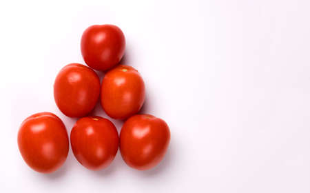 Ripe red tomatoes isolated on white background.の写真素材