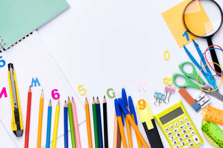 Many different school supplies on white copy space background. Back to school concept.の写真素材