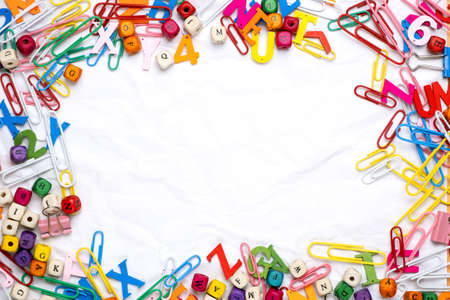 Flat lay of white notepad sheet of paper on office supplies background.