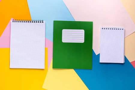Flat lay of bright white sheets of paper notepads.