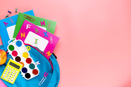 Bag with many colorful school supplies. Back to school concept.の写真素材