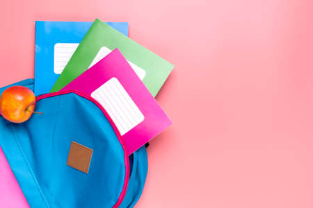 Bag with many colorful school supplies. Back to school concept.