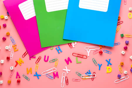 Colorful school exercise books on pink background.の写真素材