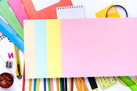 Many different school supplies on white copy space background. Back to school concept.の写真素材