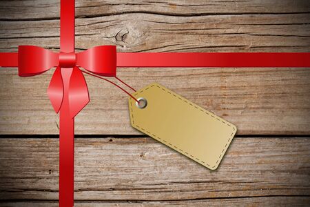 Blank tag with red ribbonの写真素材