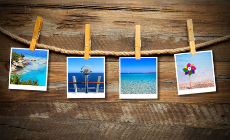 Holiday photos hanging on the clotheslineの写真素材