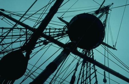The crows nest of a tall ship silhouetted against the evening sky.の写真素材