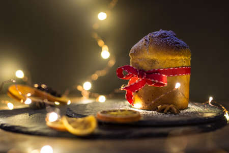 Panettone on slate with dried oranges and star aniseの写真素材