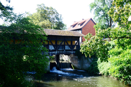 Historical Water Mill at the River Oker in the Town of Wplfenbuettel, Lower Saxonyの写真素材