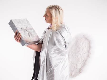 happy teenage angel girl with christmas giftの写真素材