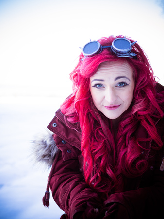 The red-haired gothic woman in winterの写真素材