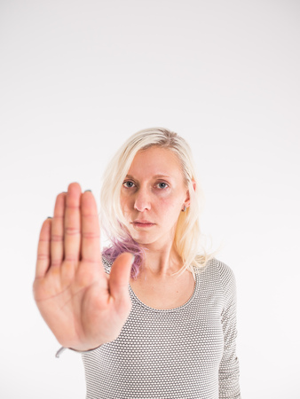 Young woman showing no with handの写真素材