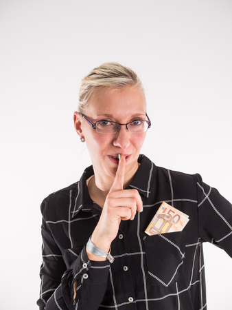 business woman puts 50 Euro in her pocketの写真素材