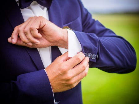 Posed groom with button hole.Wedding details, beautiful boutonniere