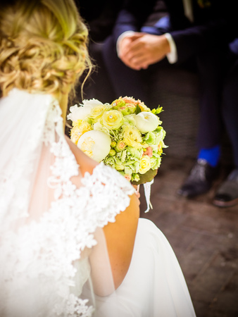 the bride is holding the bridal bouquetの写真素材
