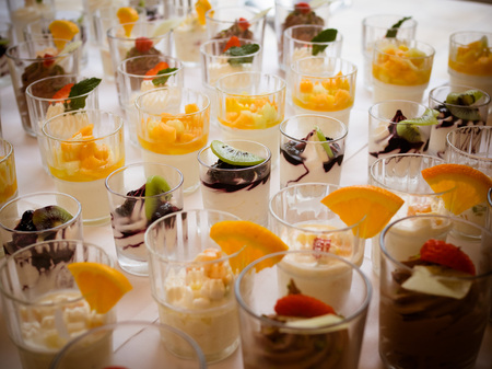 Wedding cakes set on glass shelf minicakeの写真素材