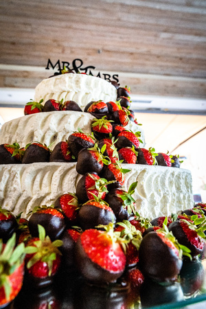 The wedding cake with strawberries and chocolate, three-tier, 3, cream and fondantの写真素材