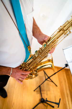 the saxophone stands and is played in goldの写真素材