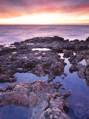 Beautiful seascape during bright sundownの写真素材