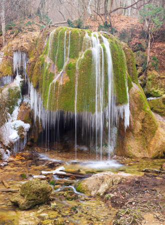 Waterfall in the canyon at the autumn timeの写真素材