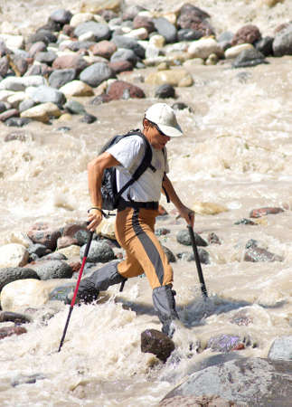 Tourist crossing the riverの写真素材